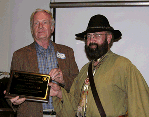 Tyler Bastian presents Robert Bantz with the William 
                    B. Marye award.