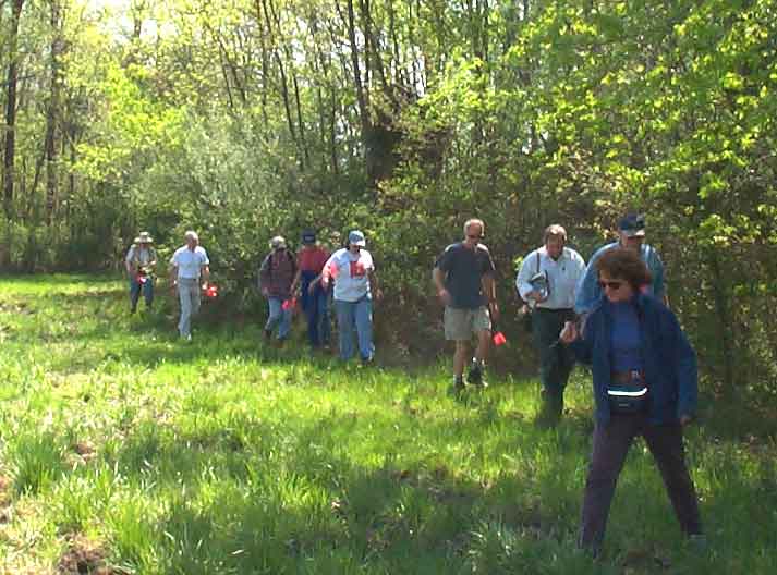 The group attempts to wade through an adjacent field.