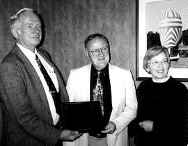 Bill McIntyre (center) receiving the Marye Award 
                                          from Tyler Bastian  and Louise Akerson