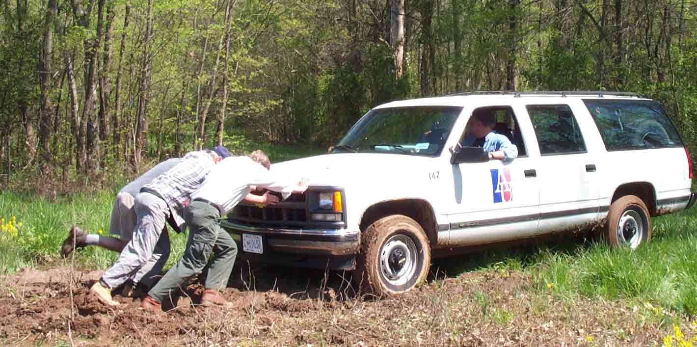 Valiant attempts to remove the AU truck from the rainsoaked field.